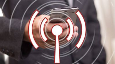 Foto del símbolo del Wi-Fi y un móvil