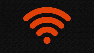 Símbolo de señal Wi-Fi en color naranja sobre un fondo negro con textura granulada.