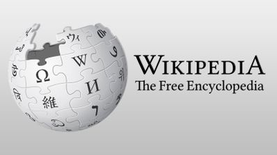 Logotipo de Wikipedia con el globo rompecabezas incompleto y el lema The Free Encyclopedia.