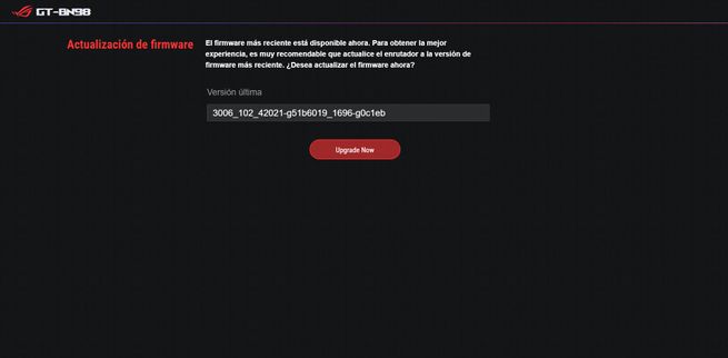 Interfaz de actualización de firmware del router ASUS GT-BN98 con mensaje de aviso y botón rojo Upgrade Now.