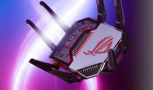 Router ASUS ROG Rapture GT-BN98 con múltiples antenas externas y logotipo iluminado sobre fondo abstracto.