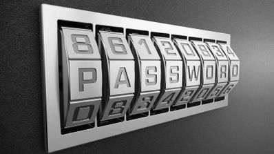 Mecanismo de combinación metálico con rodillos que forman la palabra PASSWORD.