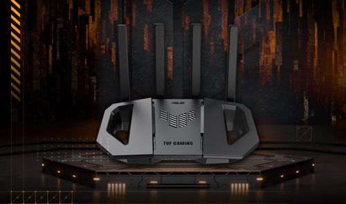 Router ASUS TUF-BE3600 con cuatro antenas externas sobre una plataforma hexagonal en un entorno de estética gaming.