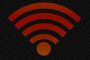 Icono de señal Wi-Fi en color rojo sobre un fondo oscuro con textura granulada.
