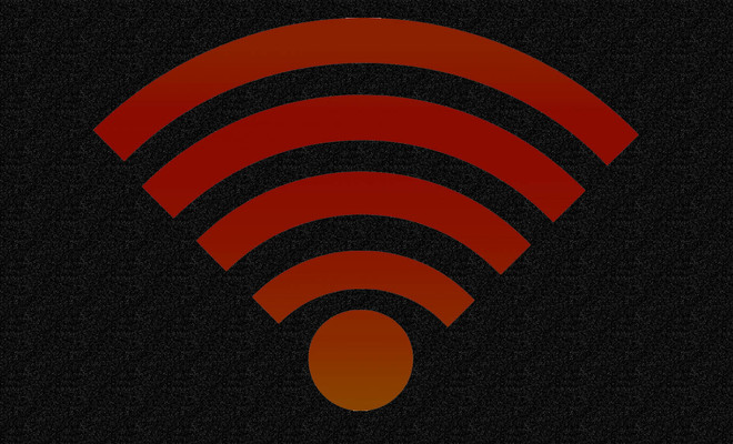 Icono de señal Wi-Fi en color rojo sobre un fondo oscuro con textura granulada.