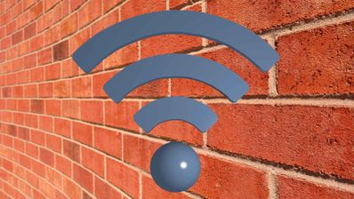 Icono de señal Wi-Fi de color azul sobre una pared de ladrillo rojo.