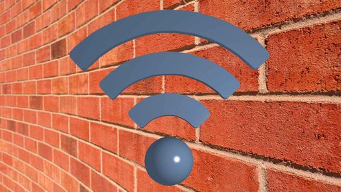 Icono de señal Wi-Fi de color azul sobre una pared de ladrillo rojo.
